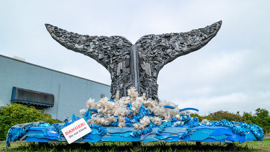 Whale mural art piece made entirely out of plastic trash found on the beach.